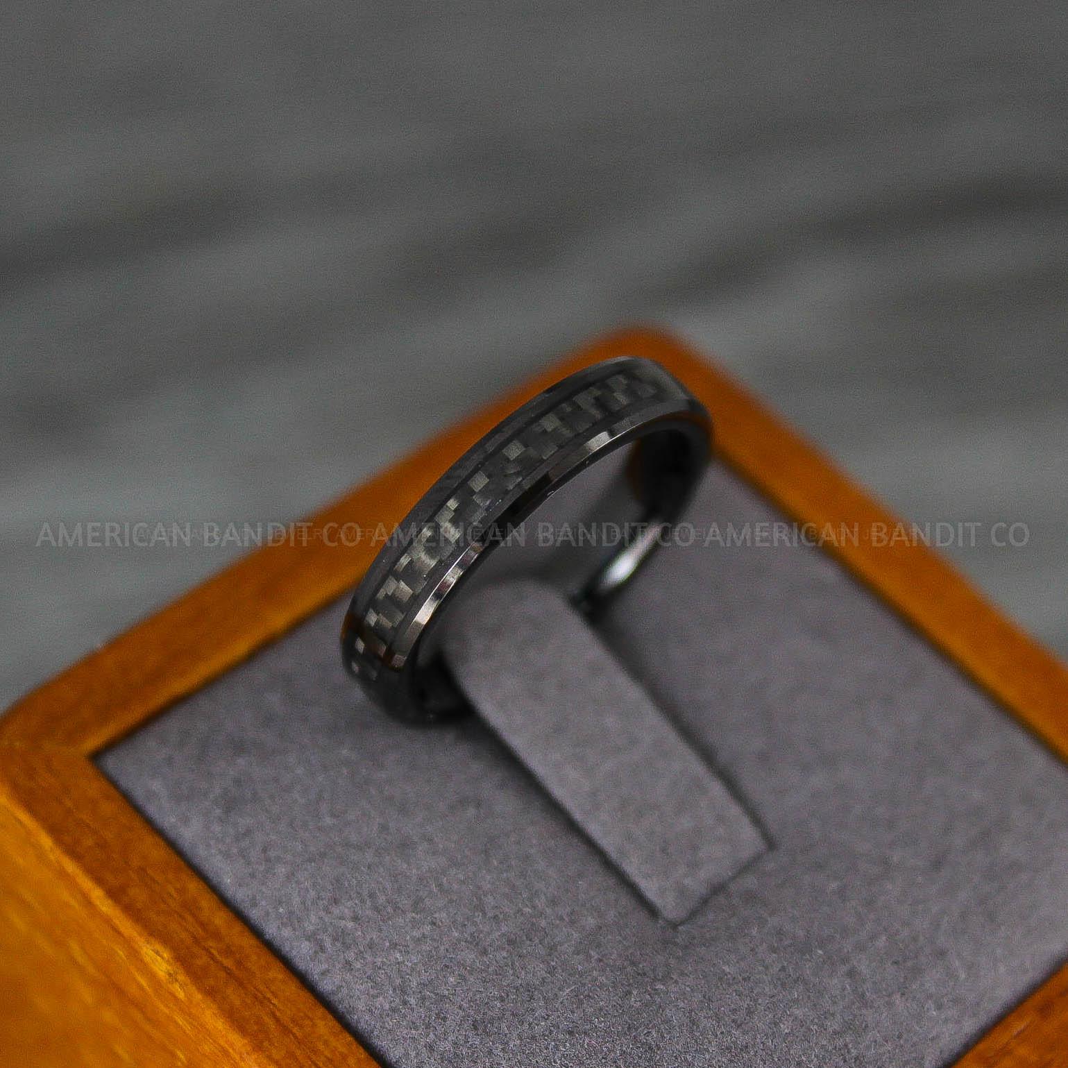 IMG_8198 Black Wedding Band, Black Wedding Ring, Black Tungsten Ring with Black Carbon Fiber Inlay, 4mm Black Ring - Image 1