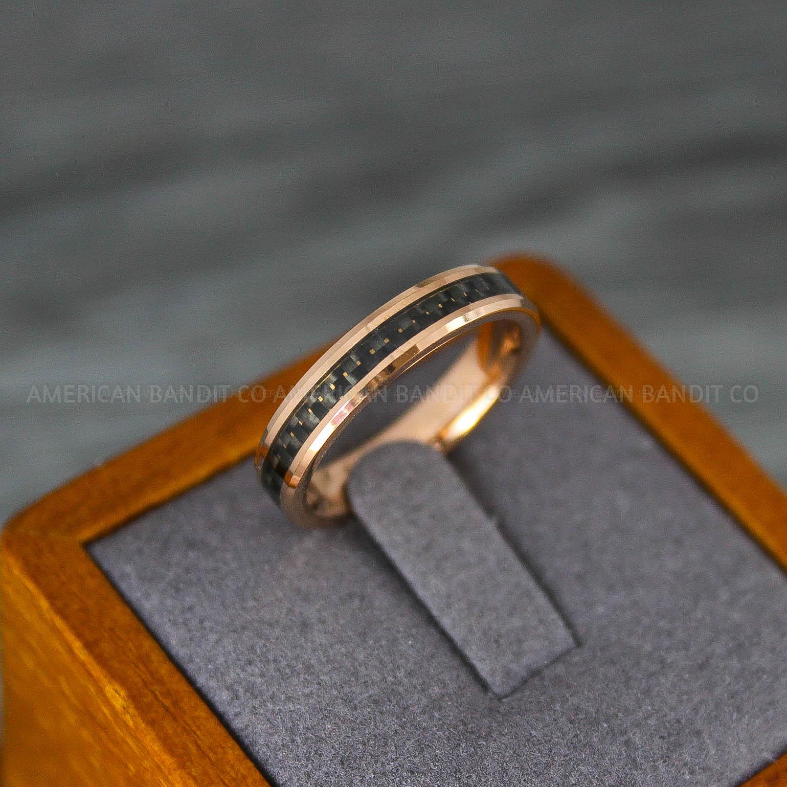 IMG_8204 Rose Gold Wedding Band, Rose Gold Wedding Ring, Rose Gold Tungsten Ring with Black Carbon Fiber Inlay, 4mm Rose Gold Ring - Image 1